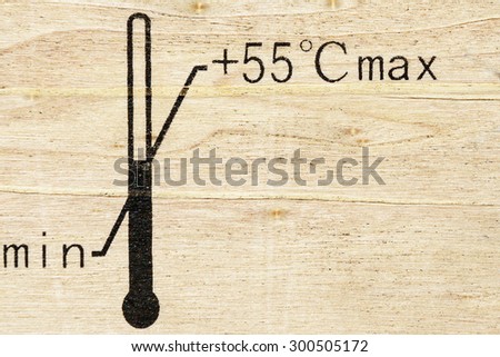 Black fragile symbol on wood , temperature