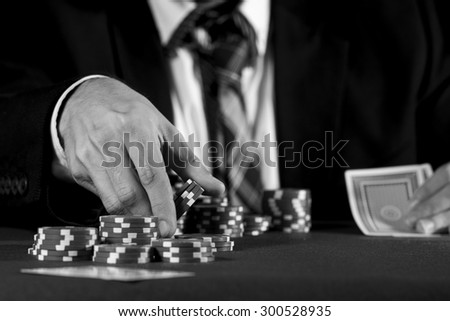 Man betting on the casino in black and white
