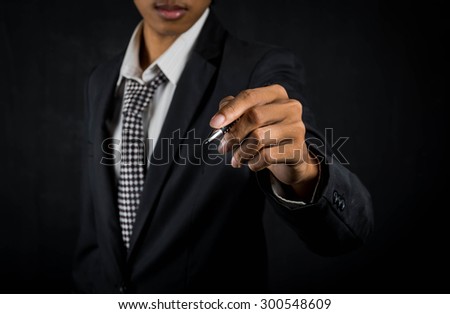 Businessman writing, drawing on the ,select focus