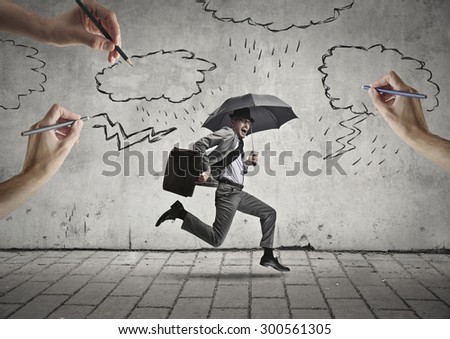 Running manager holding an umbrella Royalty-Free Stock Photo #300561305