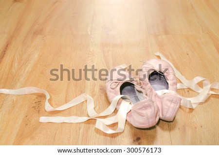 Old Ballet Slippers on the Wooden Floor Background, Ballet Shoes Made From Pink Leather, Vintage Style