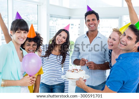 Portrait of creative business people celebrating a birthday