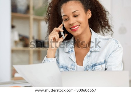 Photo of fashion designer calling her business partner