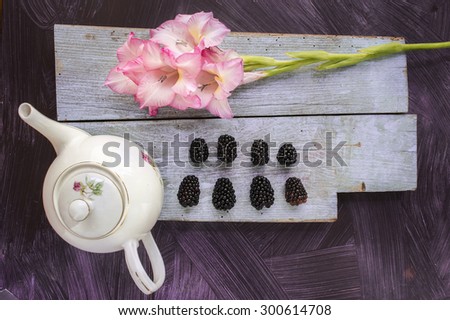 Blackberry, teapot and flower for romantic morning