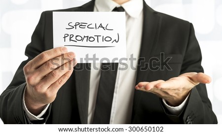 Close up Businessman or Salesman Holding Small Paper with Special Promotion  Message Against White Background.