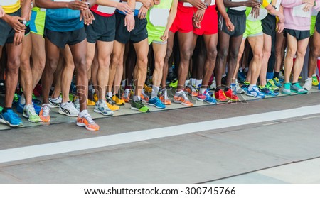 athletes waiting at marathon start line. Royalty-Free Stock Photo #300745766