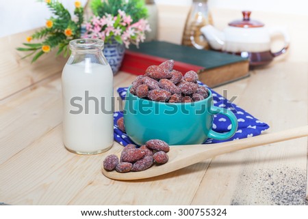 almonds  with milk on table. Selective focus, shallow DOF