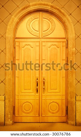 Old style closed wooden door in a church