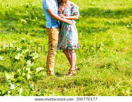Young couple in love walking in park 