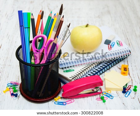 School supplies on a old wooden background