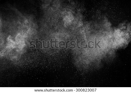 abstract white dust explosion  on a black background.  Royalty-Free Stock Photo #300823007