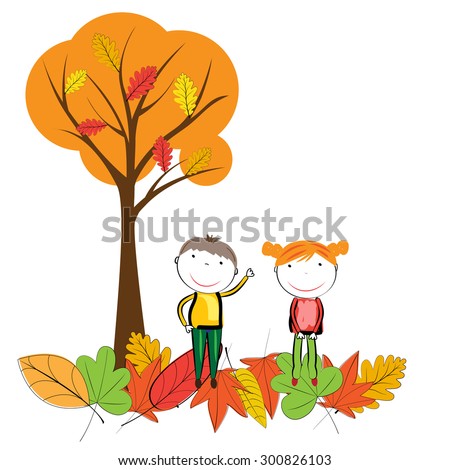 Happy children playing in the autumn leaves