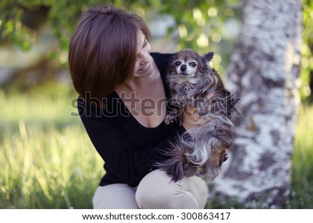 young girl with a small dog