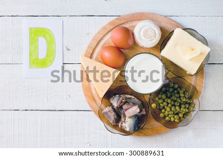 Foods containing vitamin D: cheese, eggs, mushrooms, milk, butter, peas, canned in oil Royalty-Free Stock Photo #300889631
