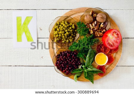 
Products containing potassium: peas, walnuts, beans, parsley, basil, egg yolk, dried apricots, tomatoes Royalty-Free Stock Photo #300889694