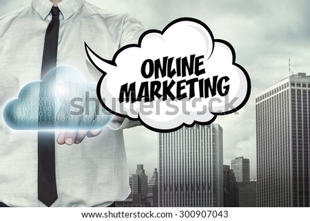 Online marketing text on cloud computing theme with businessman on cityscape background