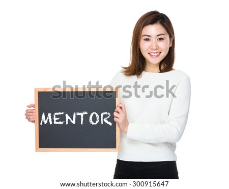 Asian woman with chalkboard and showing a word mentor