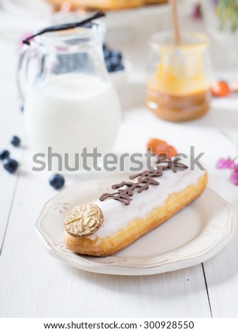 Eclairs on the wooden table