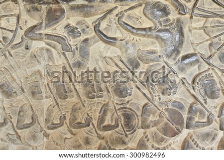 close-up texture of stone carving ancient bas-reliefs of the Temple of Angkor Wat in Cambodia