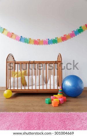 Picture of cosy baby room with simple bed