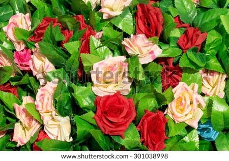 beautiful artificial roses flowers for background.