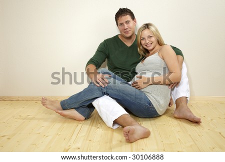 young pregnant woman with her husband