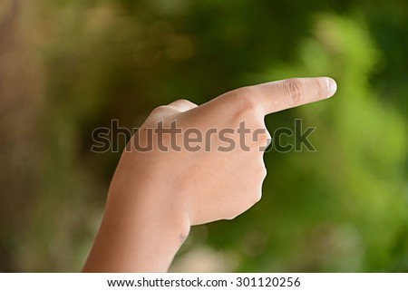 Boy hand on the nature background