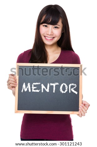 Woman with black board and showing a word mentor
