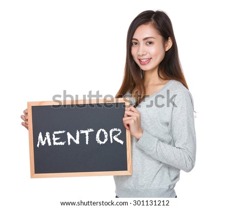 Pretty woman hold with blackboard and showing a word mentor