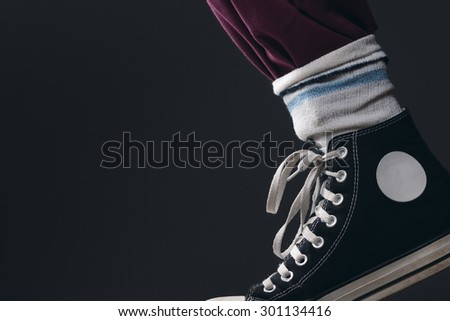 a Leg with Pants, Socks and Sneakers