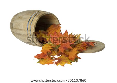 Wooden barrel with metal bands on side with fall leaves - path included