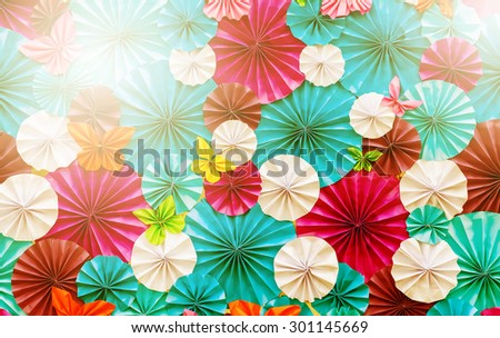 Colorful of artificial paper flowers pattern on board