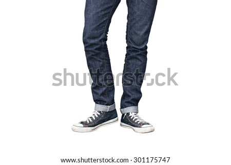 Regular Fit Straight Leg Jeans and Retro Canvas High Top Sneakers isolated on white background, selective focus (detailed close-up shot) Royalty-Free Stock Photo #301175747