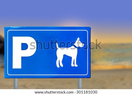 Traffic sign for dogs on a beautiful beach sunset