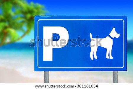 Traffic sign for dogs on a beautiful beach 