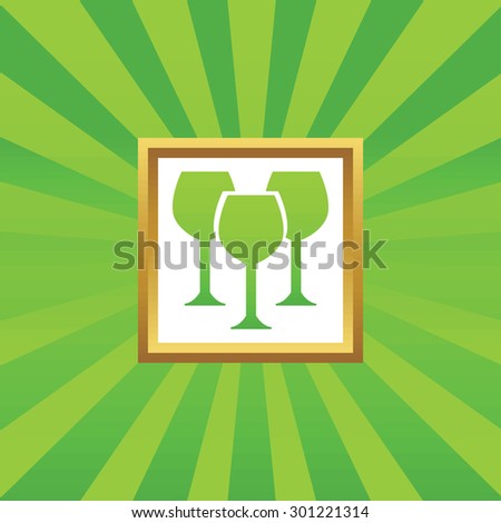 Image of three wine glasses in golden frame, on green abstract background