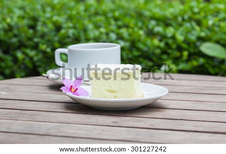 Coffee and cake on a wooden table, soft focus for background