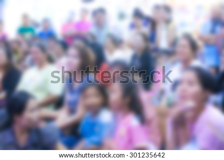  blurred people at show in hall for background usage  Royalty-Free Stock Photo #301235642