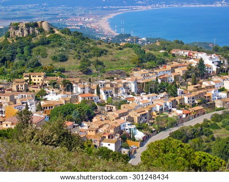 Aerial view of Begur village with the Mediterranean sea in background, Costa Brava, Spain