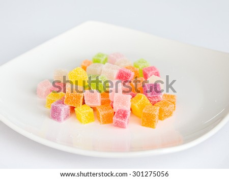  jelly candies in a cup on the white background