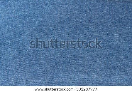 Texture of blue jeans textile close up Royalty-Free Stock Photo #301287977