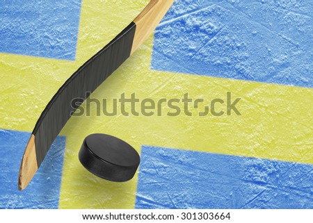 Hockey puck, stick and a fragment of an image of the Swedish flag