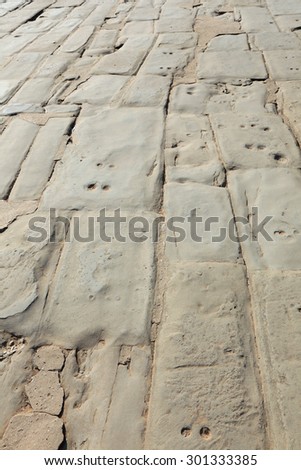 close-up texture of stone floor and tracks in the ancient temple of Angkor Wat