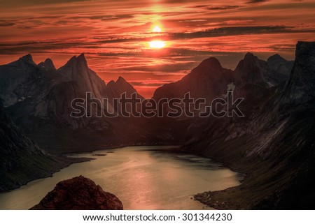 Midnight sun over Reinebringen. Summer in the Lofoten in Norway
 Royalty-Free Stock Photo #301344230