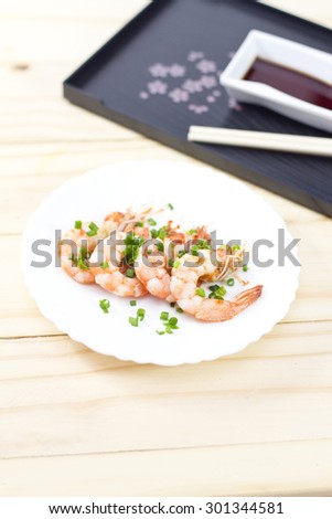 Colorful Steaming Shrimpon wooden background.
