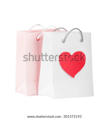 Bags with pink heart for purchases on the white