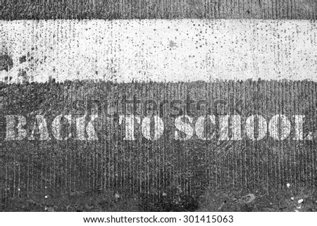 Back to school concept on road texture
