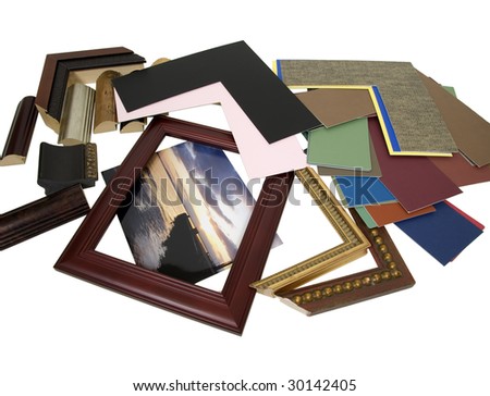 Deciding on a framing project with an assortment of colored matboard and frame samples - path included