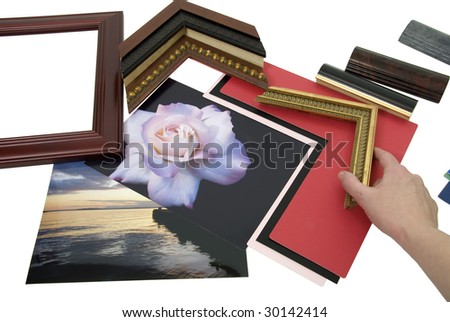 Deciding on a framing project with an assortment of colored matboard and frame samples - path included