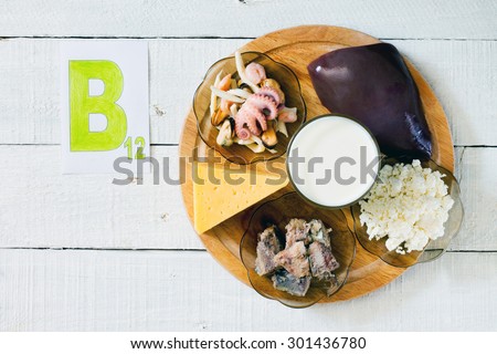 Foods that contain vitamin B 12: seafood, liver, milk, cheese, cottage cheese, sardines in oil Royalty-Free Stock Photo #301436780